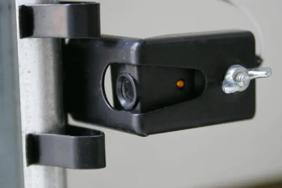 Why are garage door safety sensors required?